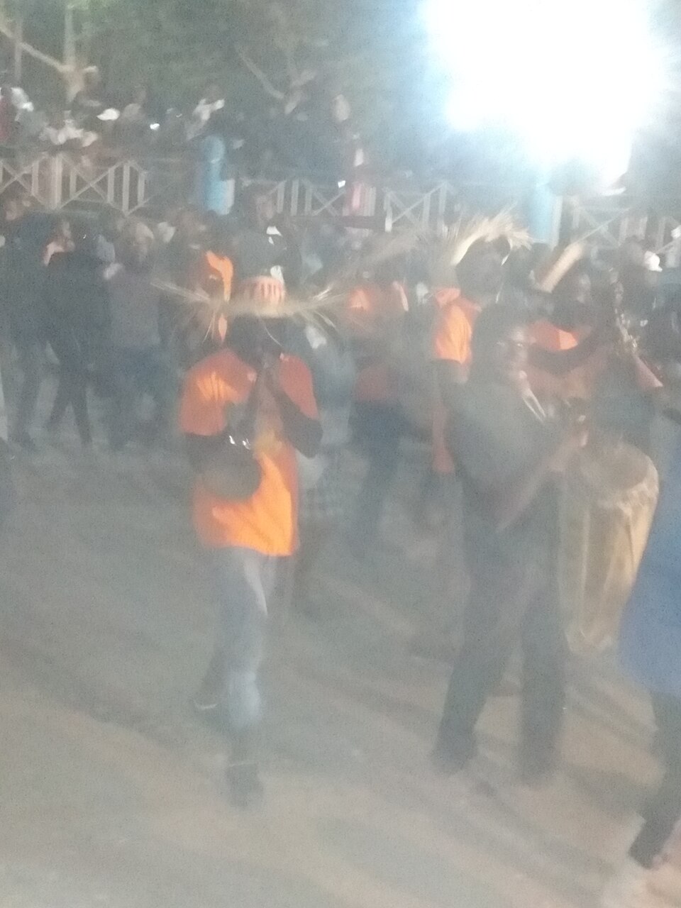 Rara musicians and dancers parading with instruments in Hinche, Haiti